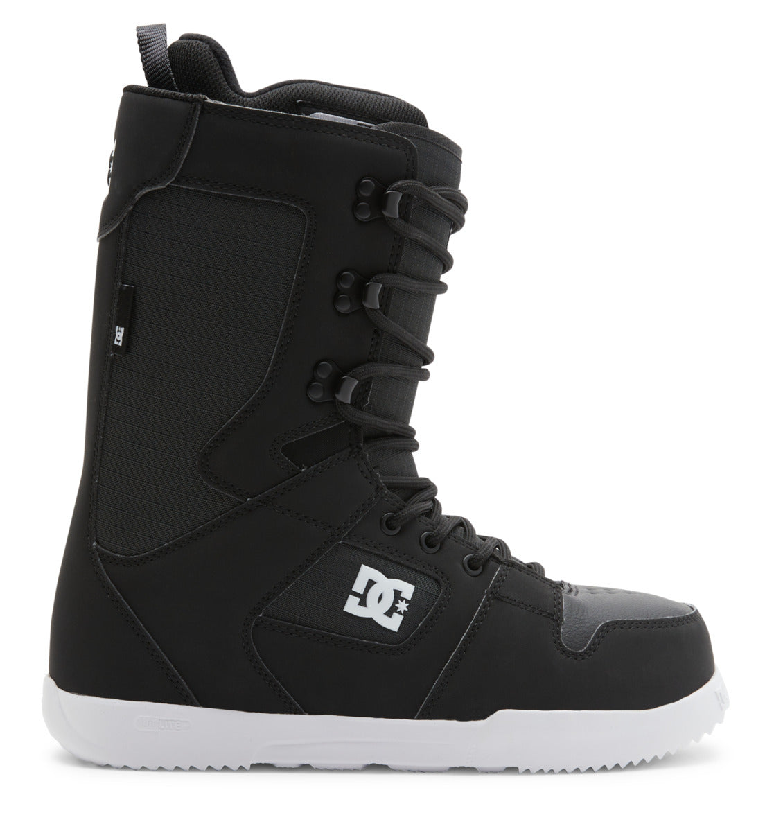 A side view of the Men’s Phase Lace Snowboard Boots by DC Shoes is shown on a white background. The boots are black with medium flex, featuring a white sole, traditional front lace closure, padded ankle support, and a DC Shoes logo on the side.