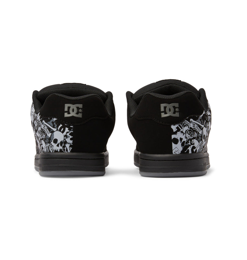 Back view of black Men’s Gaveler Shoes by DC Shoes, featuring durable leather construction, white and gray graphic skull designs near the heels, and the DC logo on the chunky heel tabs.