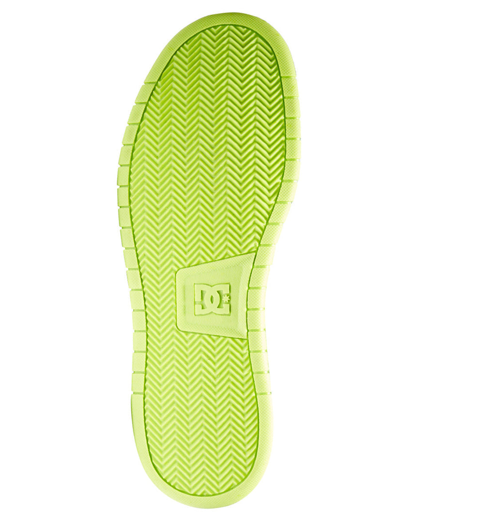 A vibrant yellow-green sole with a herringbone tread pattern and a raised DC Shoes logo in the center—designed specifically for the Men’s Gaveler Shoes by DC Shoes or other chunky sneaker styles. The durable leather shoe’s sole is displayed against a white background.
