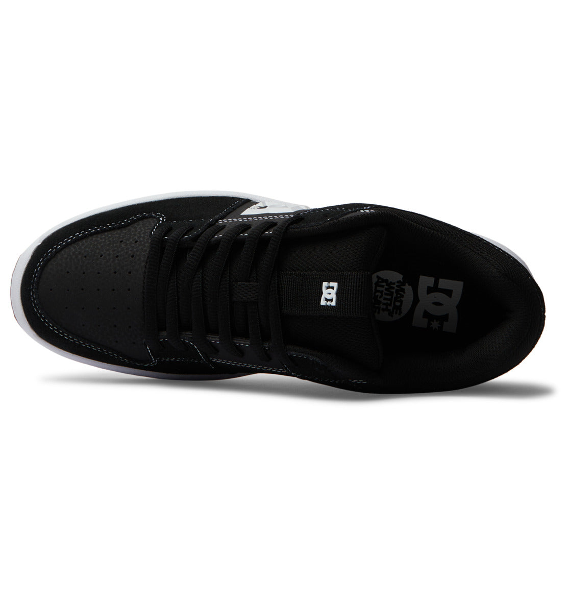 Top view of the Men’s Lynx Zero Shoes by DC Shoes in black with white accents, featuring black laces, a perforated toe, and the signature white DC logo on the insole—ideal for fans of classic skate shoe style.