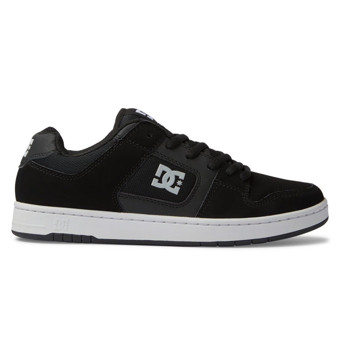 Introducing the Men’s Manteca 4 Shoes by DC Shoes—a black low-top skate shoe featuring a white sole, striking white DC logo on the side, black laces, and showcased against a plain white background. This model blends timeless style with performance-driven design for skaters.