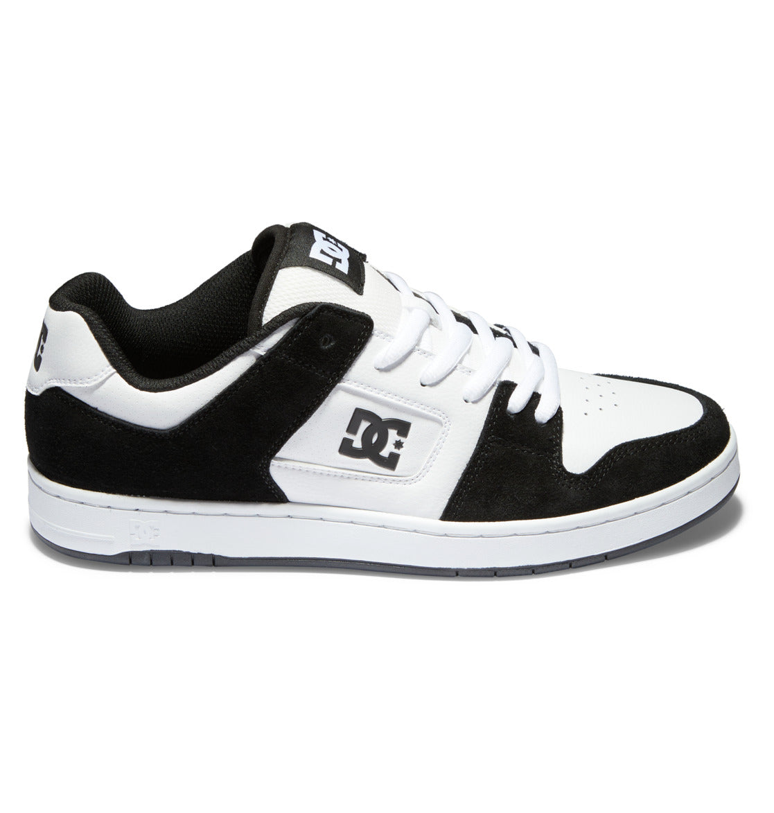 The Men’s Manteca 4 Shoes from DC Shoes feature a classic black and white design with a white sole, black suede accents, white laces, and the iconic DC logo on both the side and tongue, offering modern comfort for skateboarding and everyday wear.
