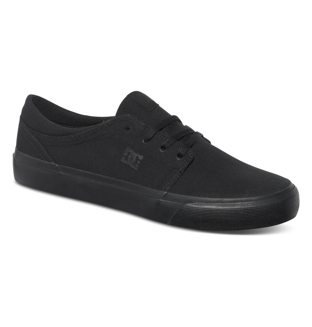 Introducing the Men’s Trase Canvas Shoes by DC Shoes—a black low-top skate shoe featuring a lace-up front, durable rubber sole, and a subtle embossed DC logo on the side. The low-profile silhouette offers clean stitching details and captures timeless skate style for a classic, minimalist look.