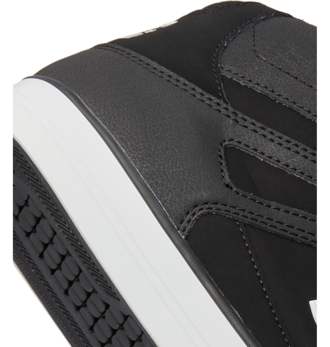 Close-up of the heel and part of the sole of a black Men’s Pure High-Top Shoe by DC Shoes, featuring a white midsole, visible stitching, and a textured rubber outsole—designed for both style and durability.