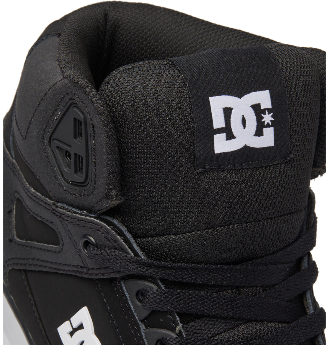 Close-up of a black Men’s Pure High-Top Shoe by DC Shoes, featuring a white DC logo on the tongue and side, black laces, and a padded collar for comfort and durability.