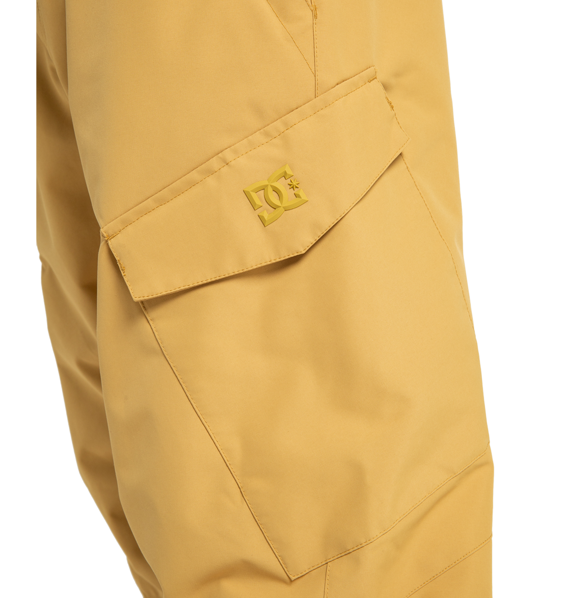 Close-up of a mustard yellow cargo pocket on the Men’s Banshee Insulated Pants by DC Shoes, showcasing a flap with the embossed DC Shoes logo above the pocket. Made from recycled polyester, these men’s ski pants offer both style and functionality for your next adventure.