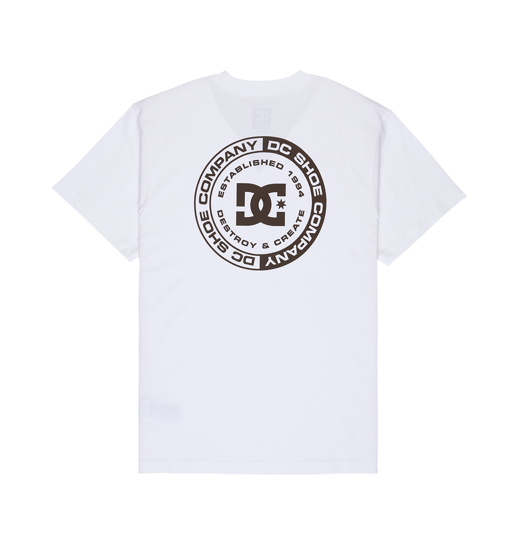 The Men's DC Corpo Tee by DC Shoes is a white relaxed fit t-shirt featuring a large circular black graphic on the back with the DC Shoes logo, “DC Shoe Company,” and “Established 1994.”.