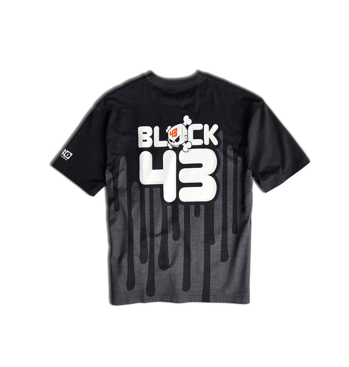 The Men’s Big Drip HSS T-Shirt by DC Shoes features a black design with bold white BLOCK 43 lettering and a cartoon character on the back, inspired by Ken Block’s iconic Drips livery. The black drip graphic flows from the bottom, while a small logo is featured on the right sleeve—making it a must-have for Ford Fiesta fans and motorsport enthusiasts.