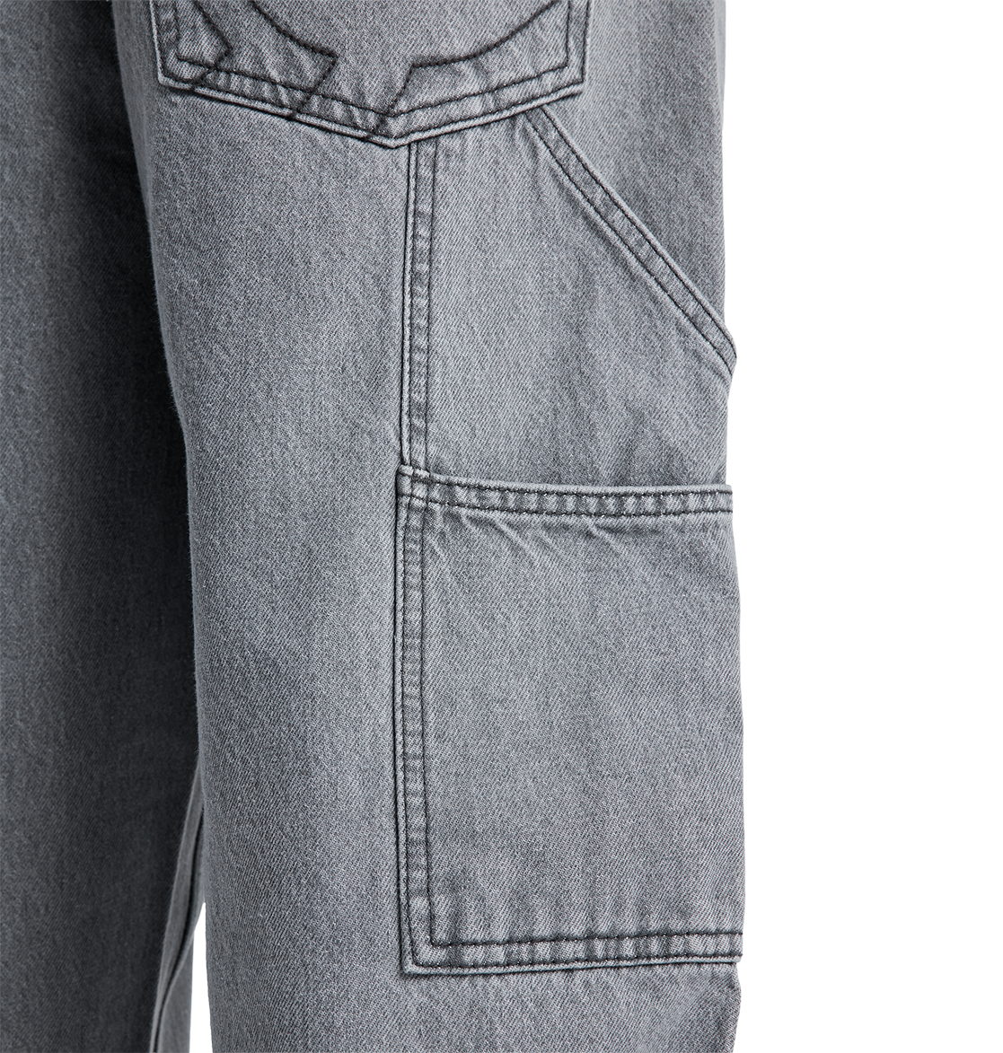 Close-up of the DC Shoes Men's Baggy Denim Carpenter Pant in gray, showing a large rectangular side pocket with visible stitching and part of another pocket above it, highlighting the signature baggy carpenter jeans style.
