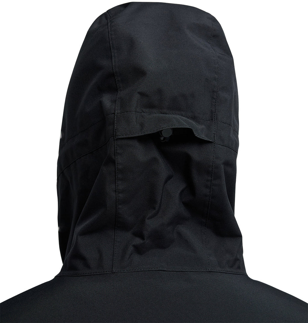 Close-up of the back of the black DC Shoes Basis Jacket 10K with hood, highlighting the intricate stitching details and a small tab or flap near the top center of the hood.
