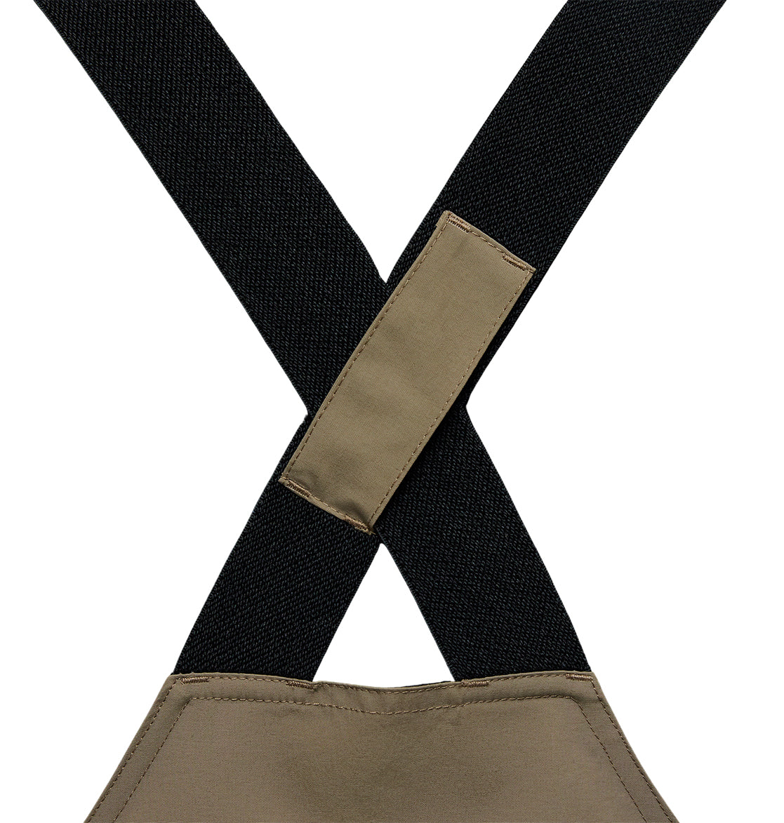 Close-up of two black fabric straps crossing and sewn together with a rectangular tan patch, attached to matching tan fabric below—part of the DC Shoes Mountain Lab Bib 20K, designed for breathable protection and reliable snow performance.