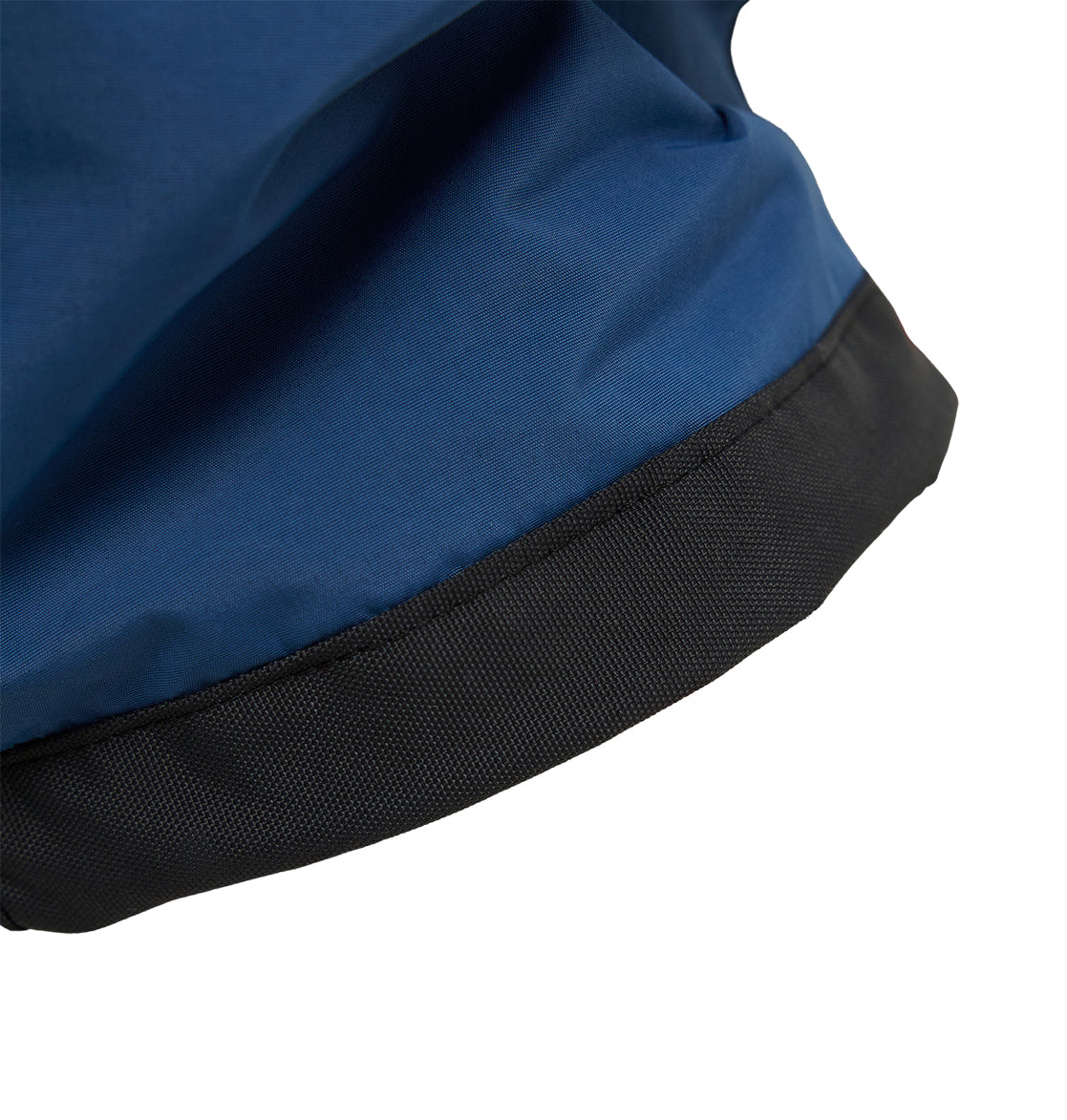 Close-up of the blue, breathable fabric and black textured edge—likely the cuff or hem—of DC Shoes Mountain Lab Pants 10K snow pants, shown against a white background.
