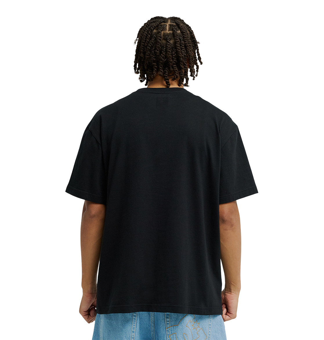 A person with short twists is shown from the back, wearing the Men’s DC Strass Star Tee by DC Shoes in soft cotton, paired with light blue jeans against a white background.