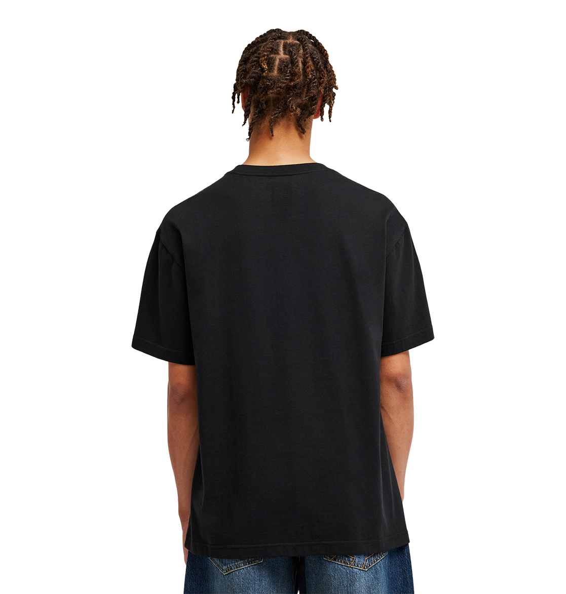 A person with short, twisted hair is shown from behind wearing the DC Shoes Men’s DC Strass Star Tee in black paired with blue jeans, standing against a light gray background.