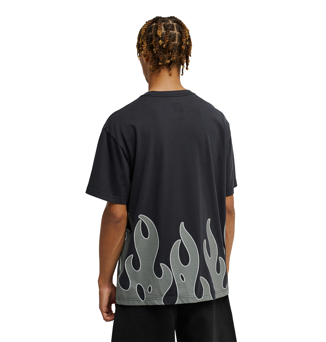 A person stands facing away, wearing the Men's DC Burning Diamonds Tee by DC Shoes—a black graphic skate shirt featuring a gray flame pattern along the bottom edge. The background is plain white.